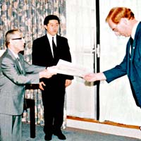 Dye Sensei receiving his 3rd Dan Aikido Certificate from Gozo Shioda, with Hideo Nakano Sensei observing, 1990