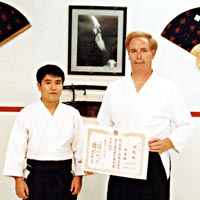 Dye Sensei receiving Shuyokan's Dojo Certificate from Yasuhisa Shioda Sensei, 1990